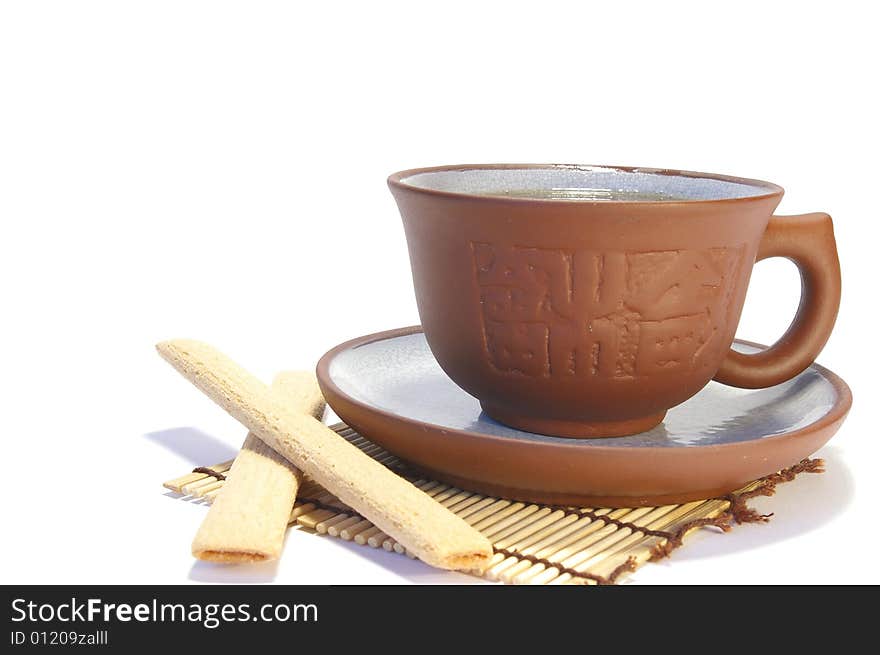 Ceramic cup of tea and cookies