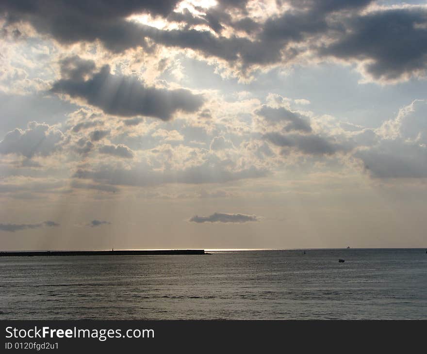 Sunset on the seaside with clouds and sea. Sunset on the seaside with clouds and sea