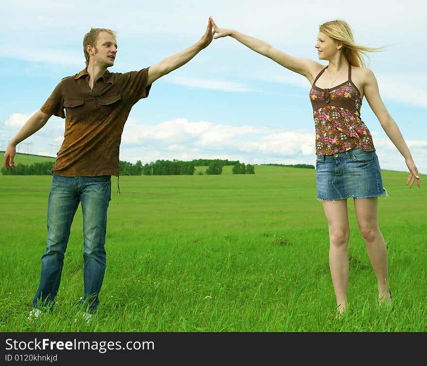 Young Couple Playing Around In The Nature