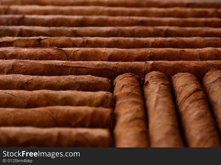 Pattern of cigars arranged next to each others