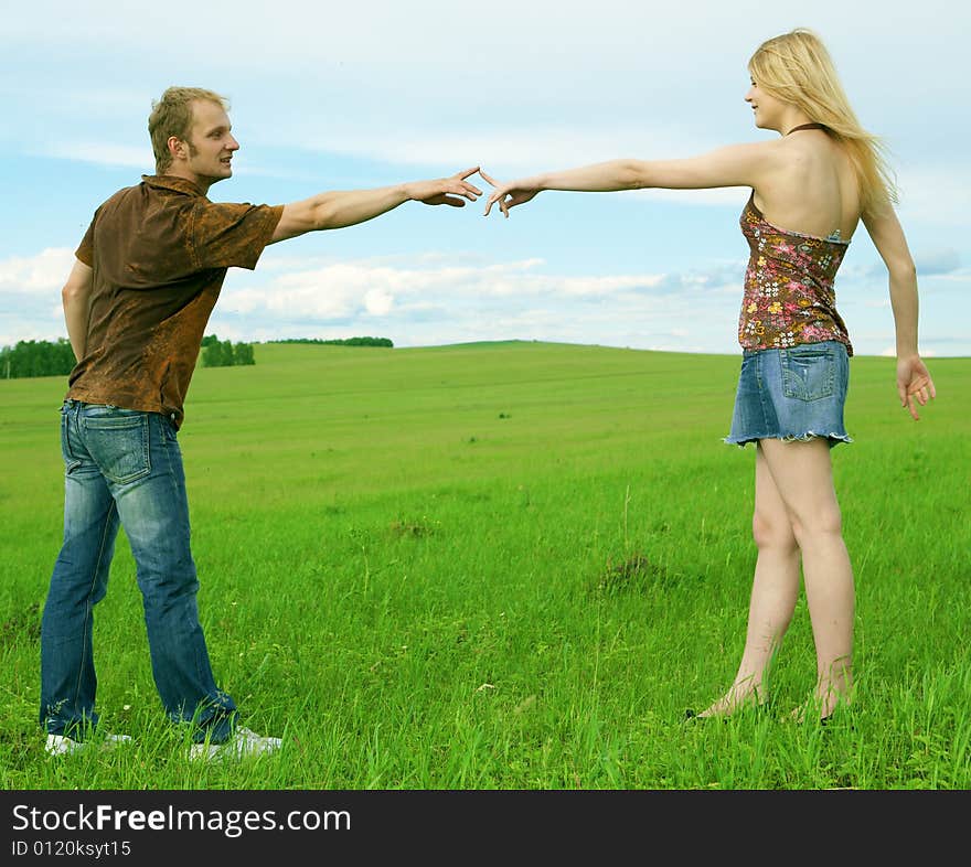 Young Couple Playing Around In The Nature