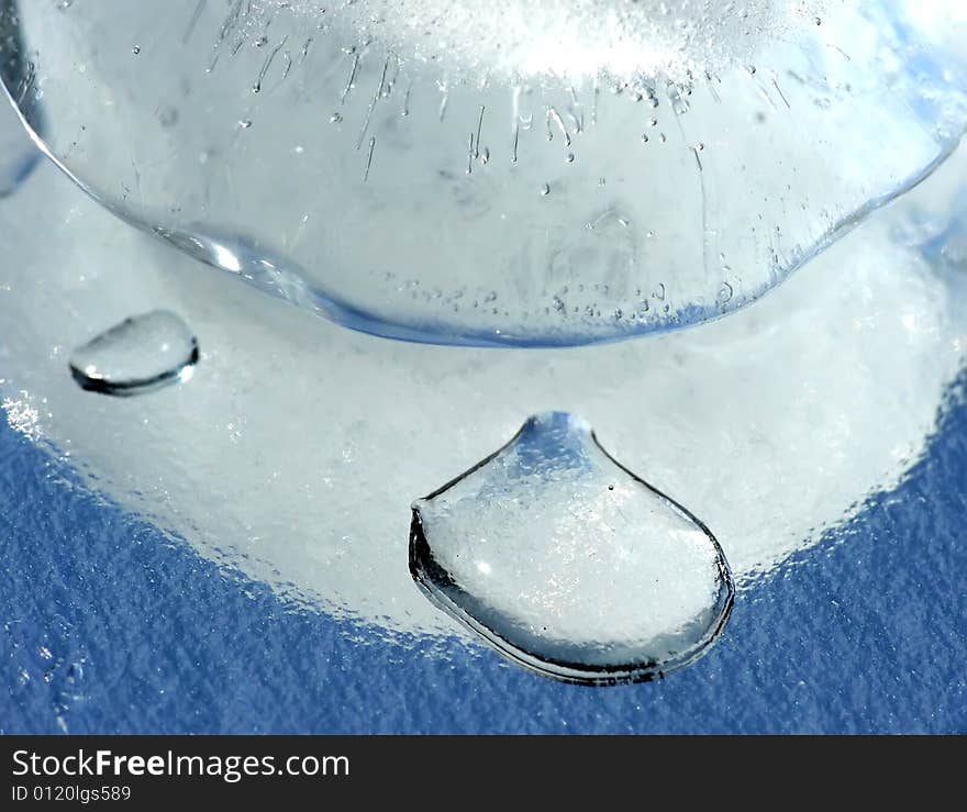 Ice cube on mirror as background