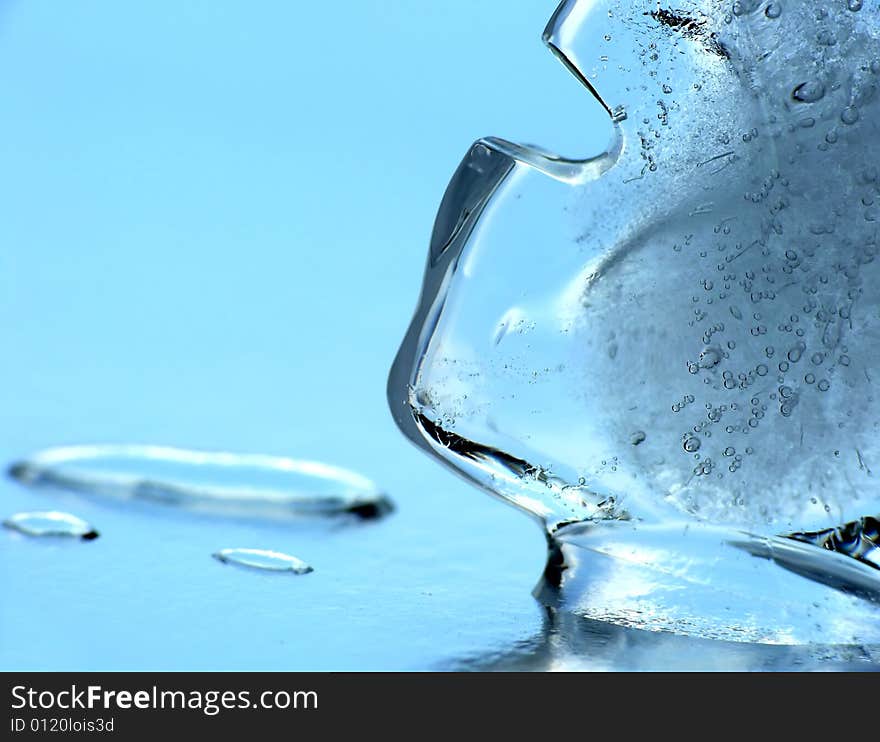 Ice cube on mirror as background. Ice cube on mirror as background