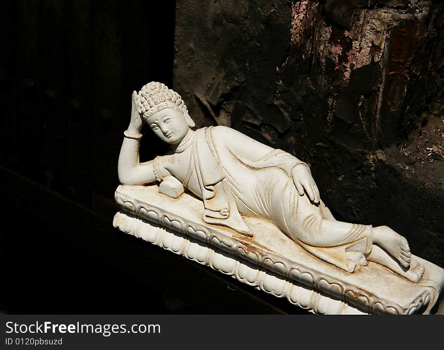 Stone carved buddha lying  figure