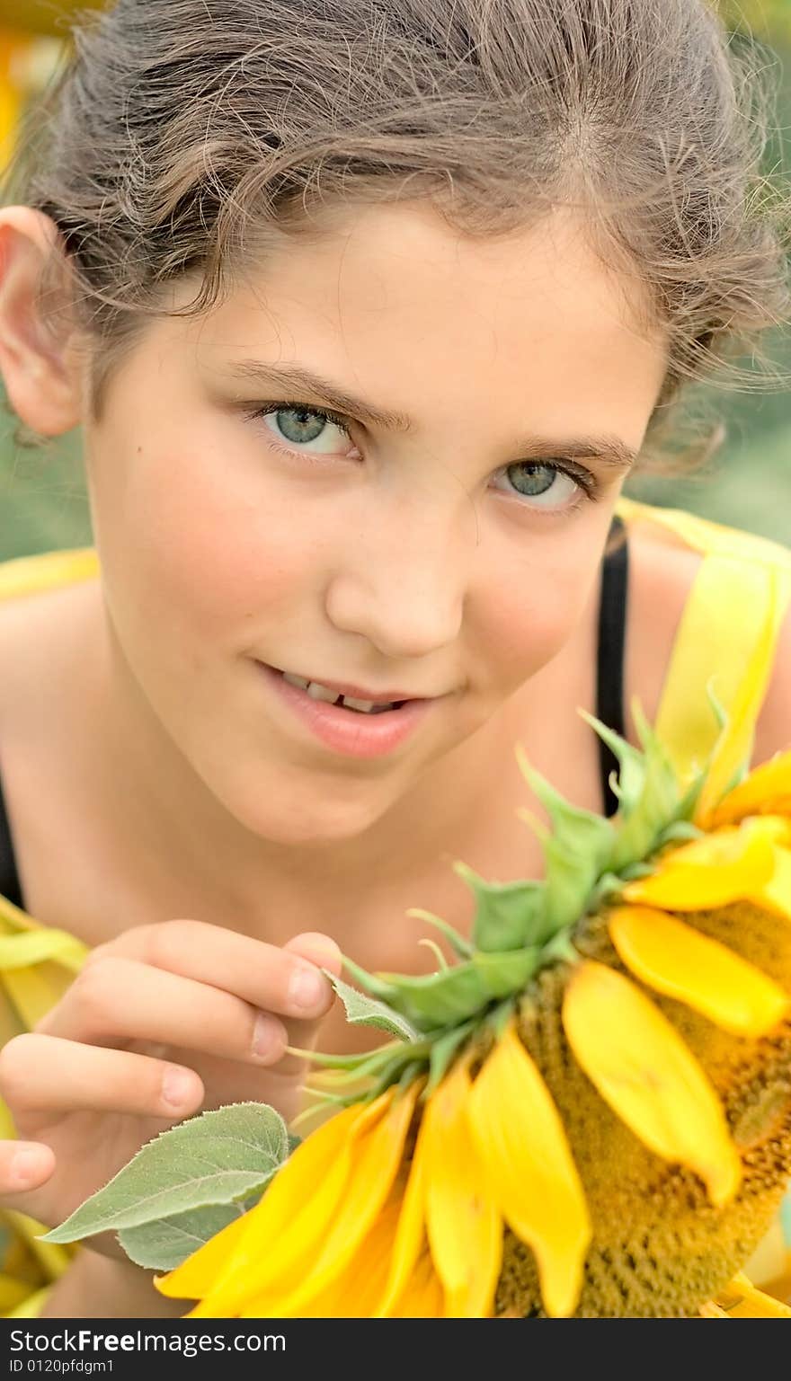 Beauty teen girl and sunflower