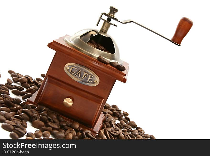 Old-fashioned coffee grinder with coffee beans