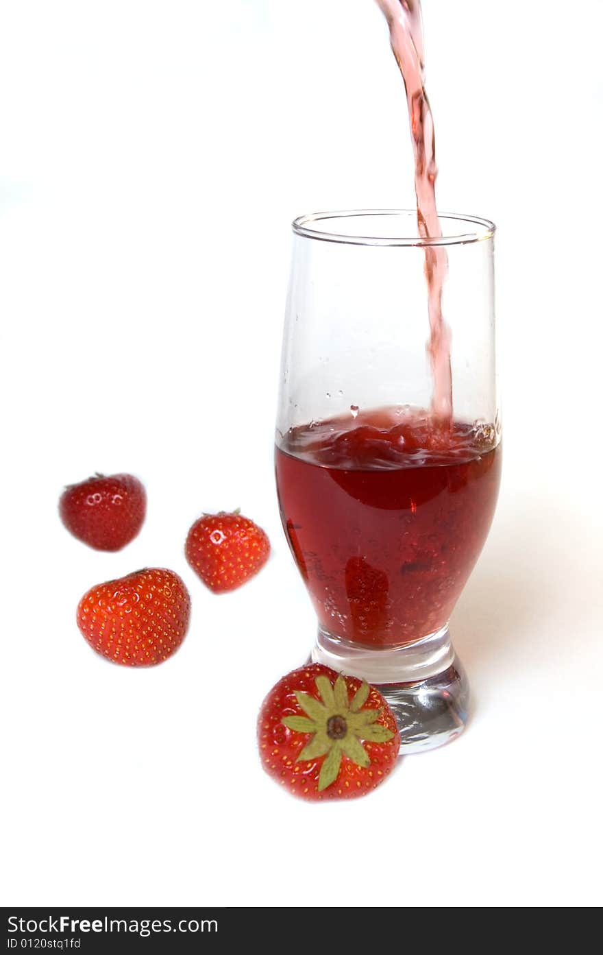 Red champagne in a glass with strawberries, isolated on white