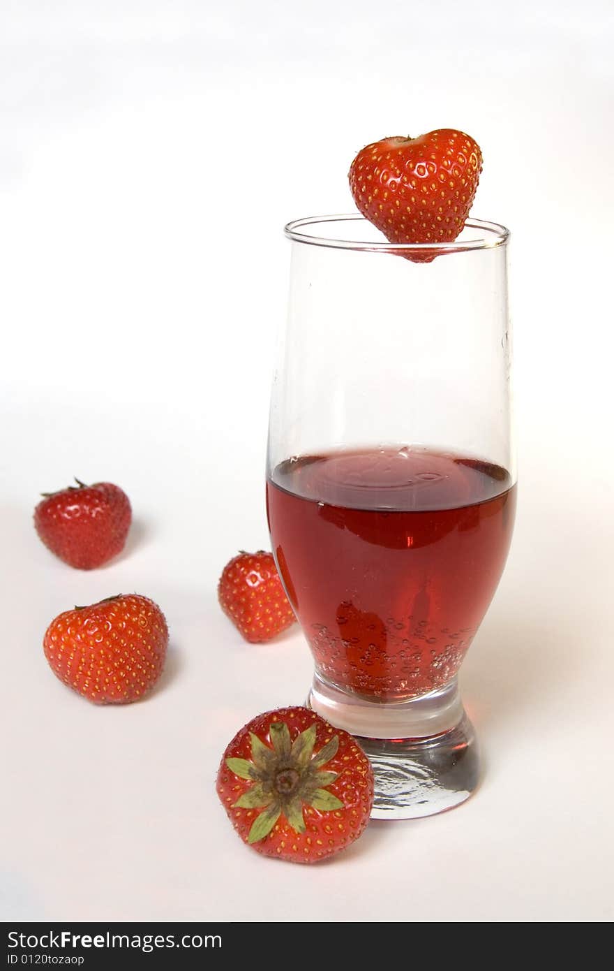 Red champagne in a glass with strawberries, isolated on white. Red champagne in a glass with strawberries, isolated on white