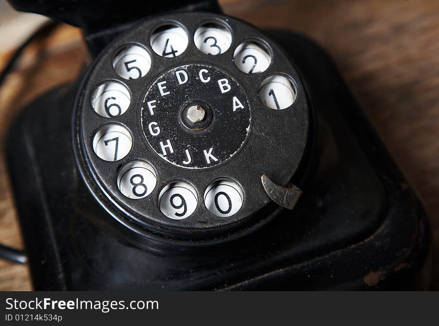 An image of black retro telephone in the studio. An image of black retro telephone in the studio.