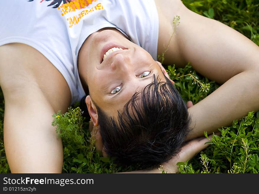 Man lie on grass in the park