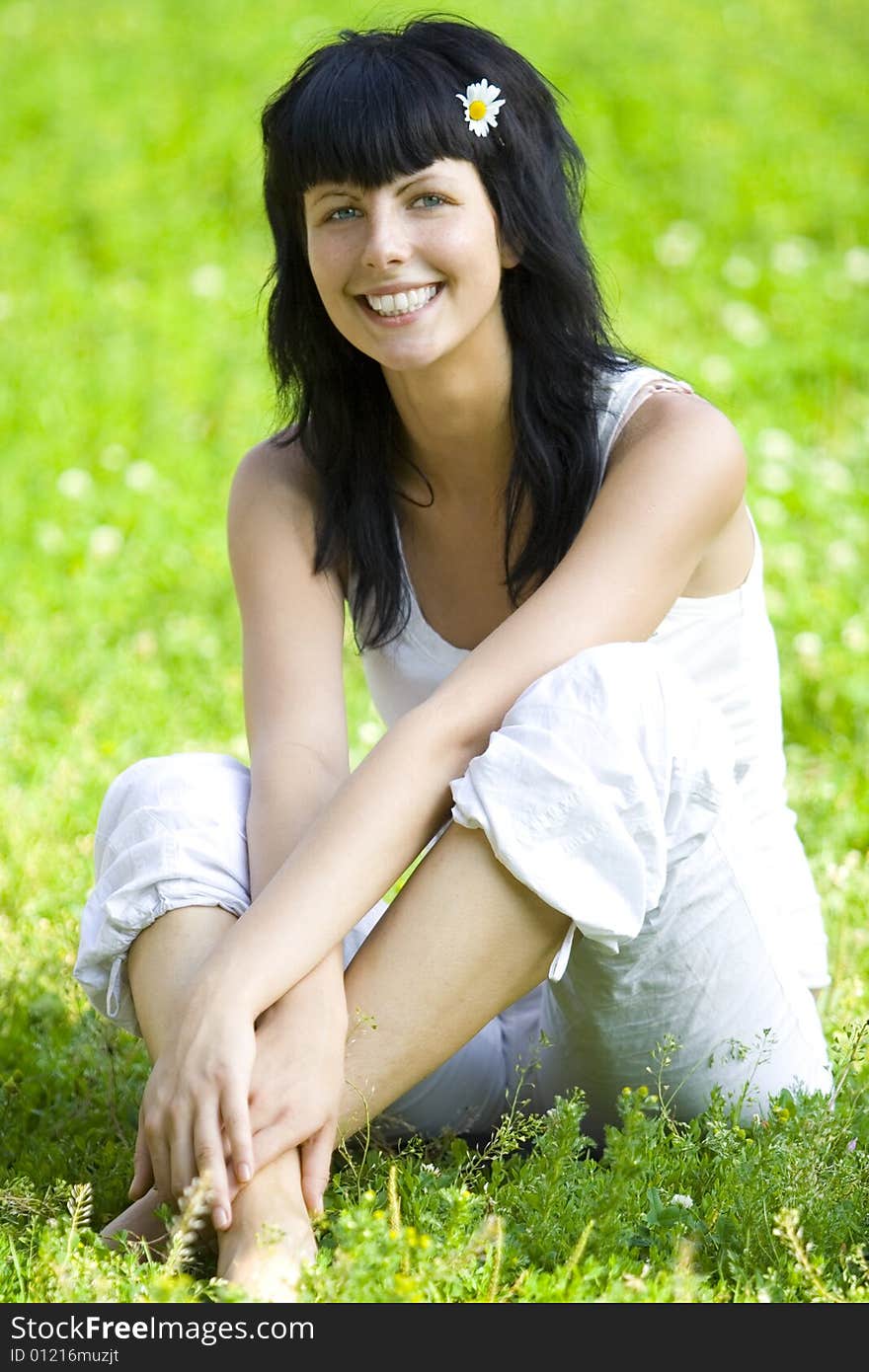 Woman Sitting On Grass