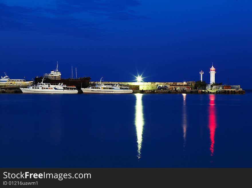 Ships near the pier. Shot at night. Ships near the pier. Shot at night.