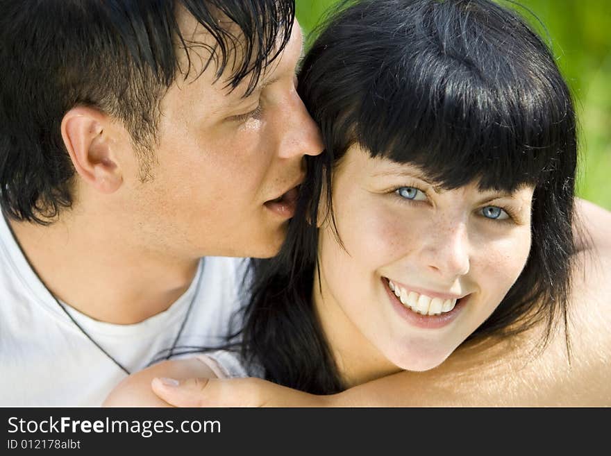 A young couple having fun in the park. A young couple having fun in the park