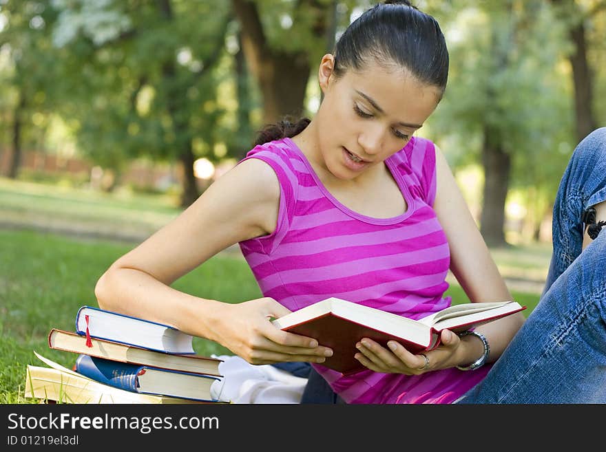 Young woman reading outdoor