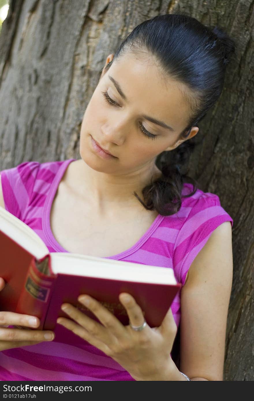 Young Woman Reading Outdoor