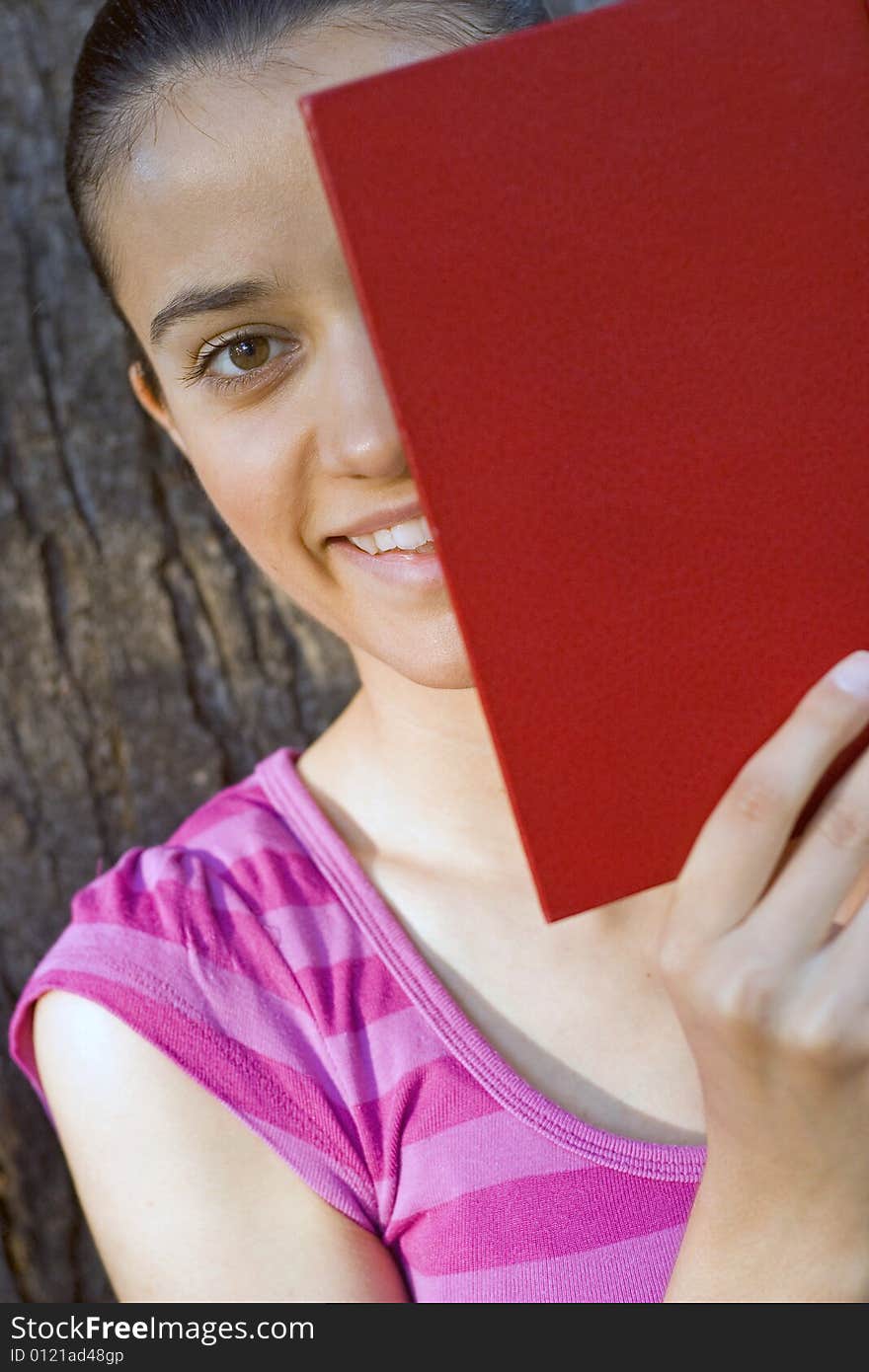 Young woman reading outdoor