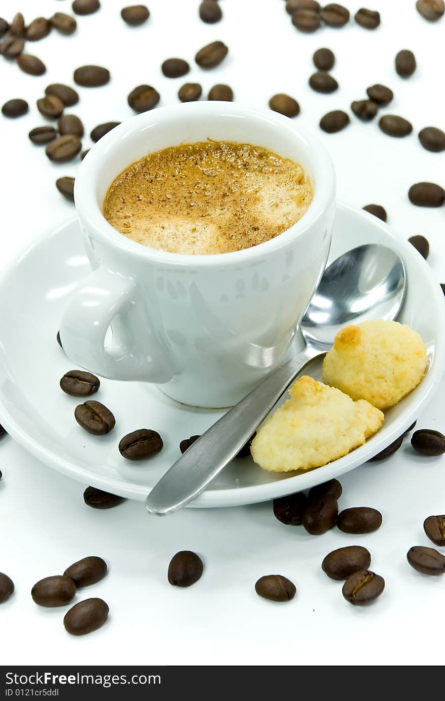 Espresso and coffee beans on the white background