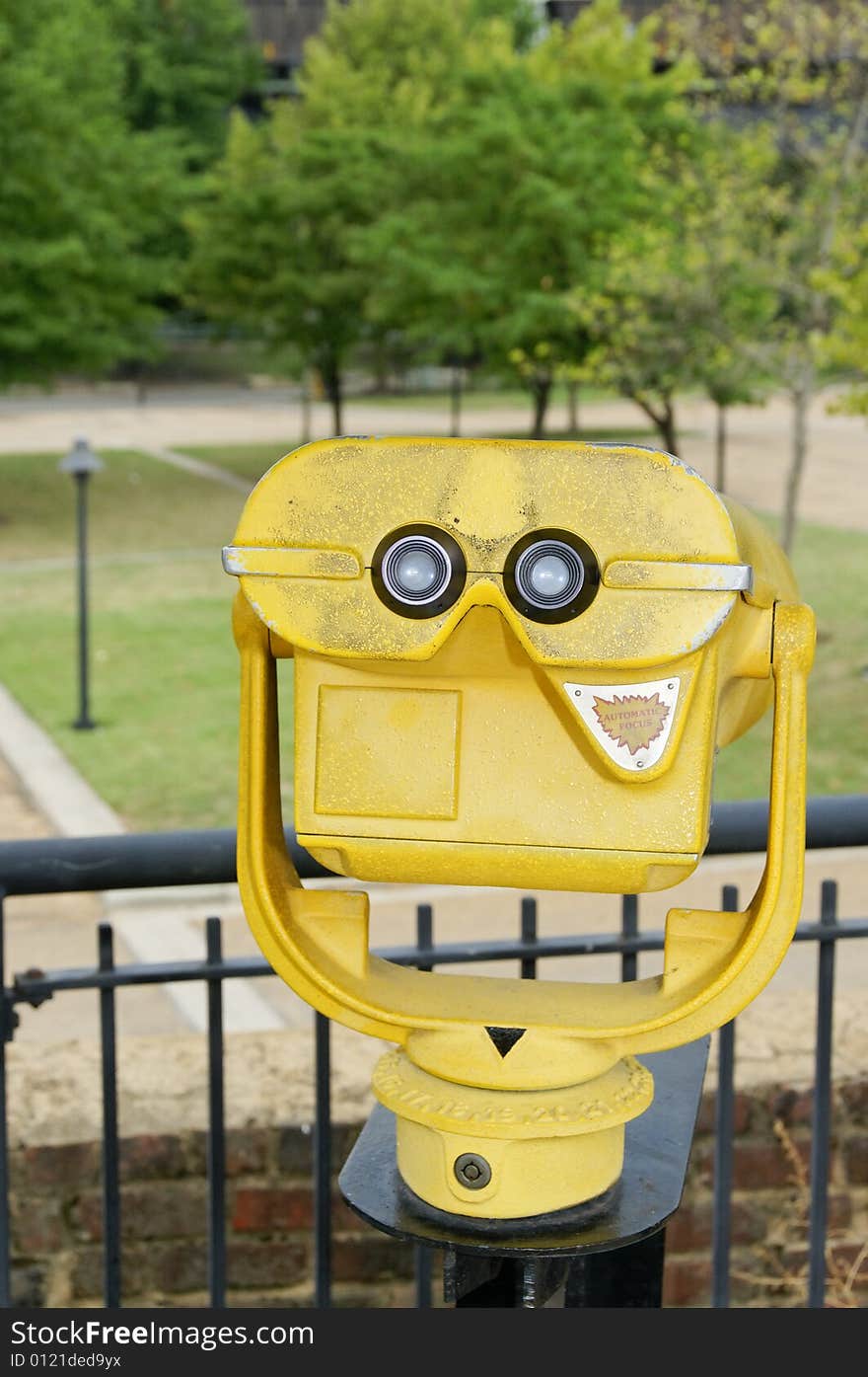 Commercial grade sightseeing binoculars at a scenic overlook.