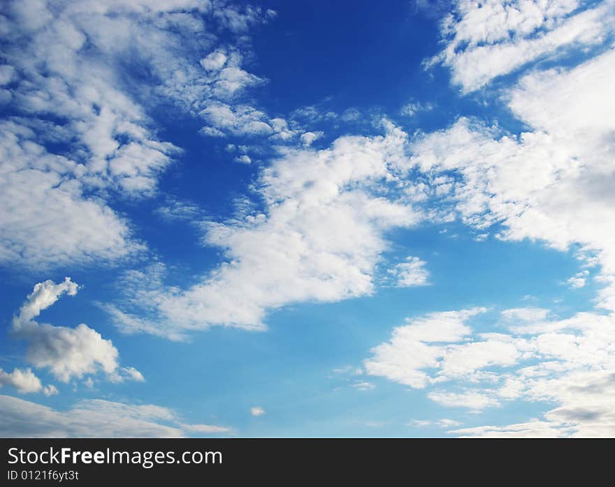 White clouds in a blue sky. Great background. White clouds in a blue sky. Great background