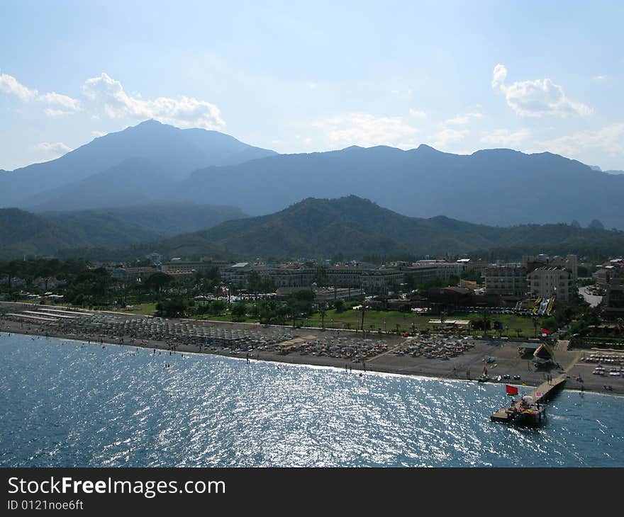 An aeroview of a mountain beach scene.