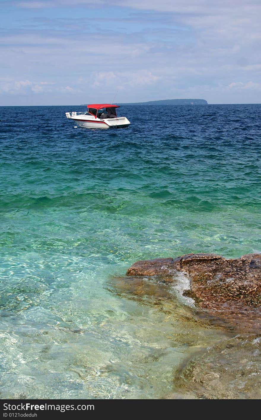 Boat Near A Rocky Shore