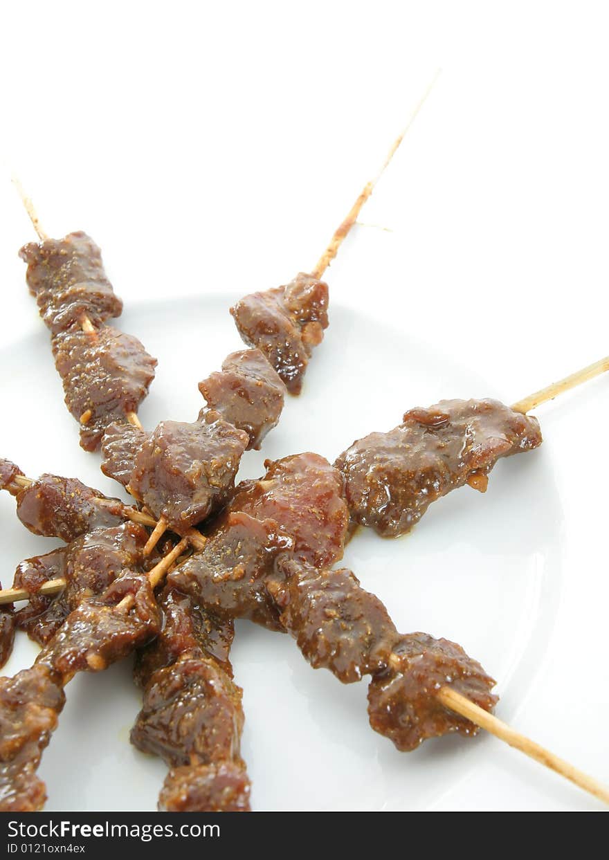 Satay or sate dice-sized meat on bamboo skewer