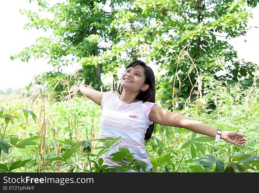 Girl in field and enjoy the fresh air. Girl in field and enjoy the fresh air