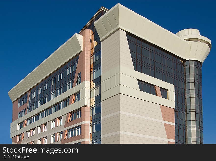 Modern office building with blue sky background