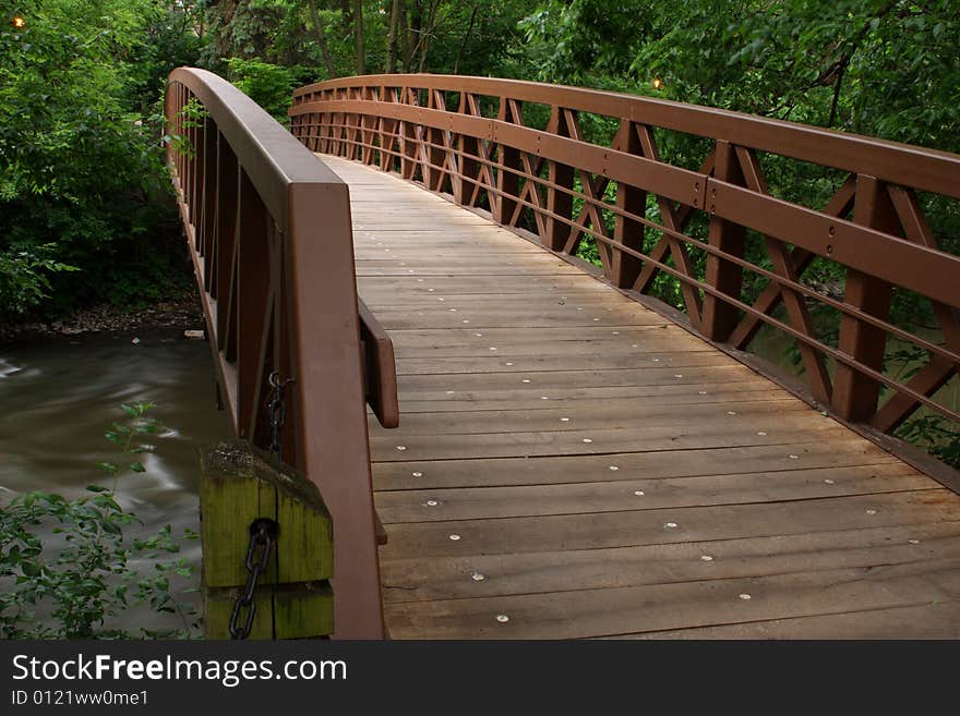 Pedestrian bridge to the other side of the river. Pedestrian bridge to the other side of the river