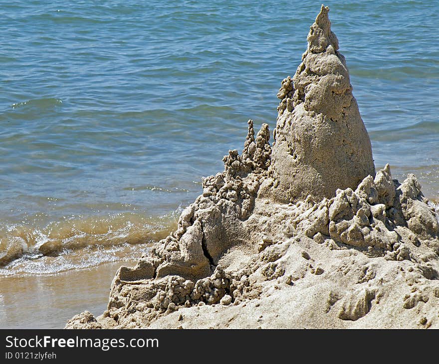 Unique sandcastle built on the beach. Unique sandcastle built on the beach.