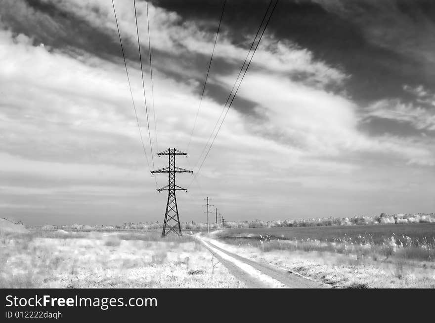 Landscape: road,  field, clouds and electric column. Monochrome. Landscape: road,  field, clouds and electric column. Monochrome