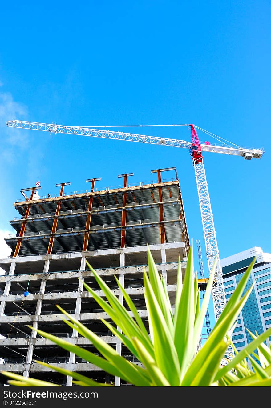 Construction crane with blue sky background