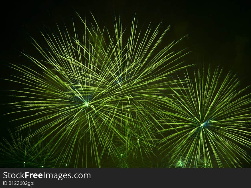 Green fireworks stars in black sky. Green fireworks stars in black sky