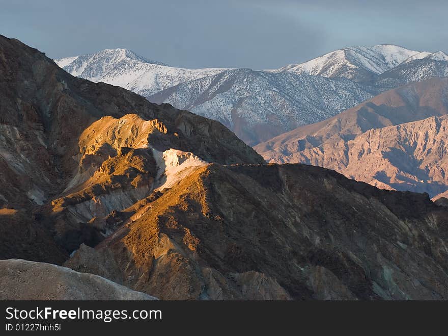 The Artist's Palette in Death Valley is very beautiful under morning light with the snow mountain backdrop of Sierra Nevada.