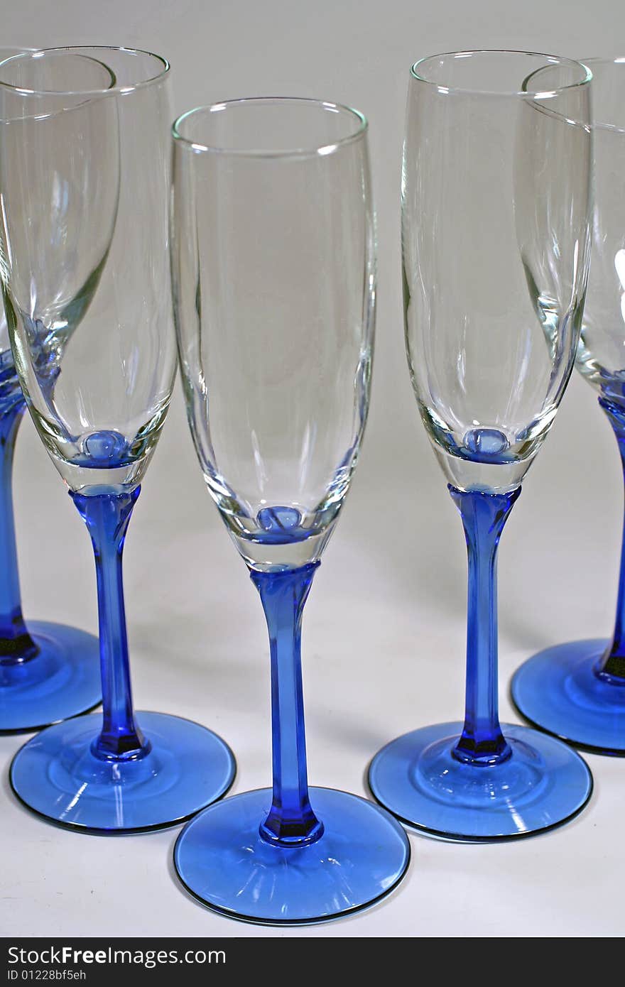 Triangle Of Shiny Blue Wine Glasses