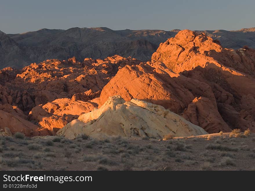 Red rocks called Valley of Fire with the backdrop of black mountains. Red rocks called Valley of Fire with the backdrop of black mountains