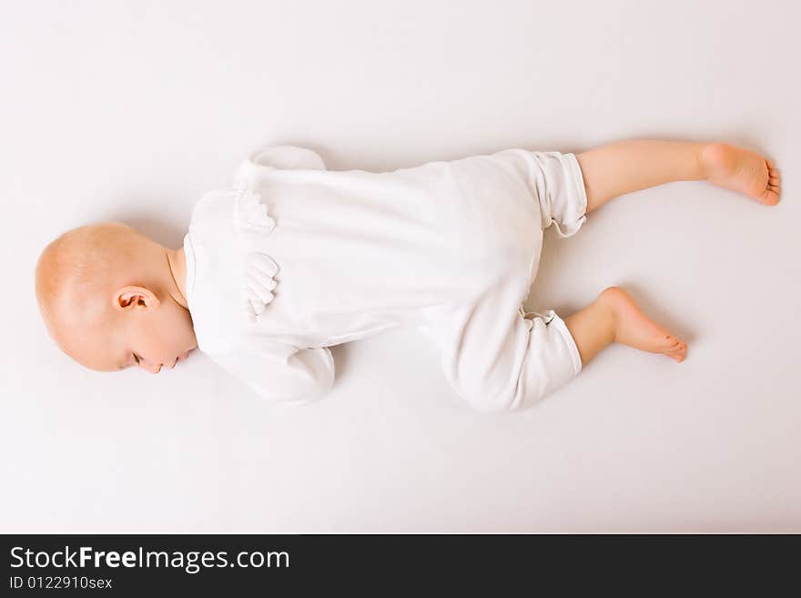 One year old baby boy asleep with angel wings. One year old baby boy asleep with angel wings