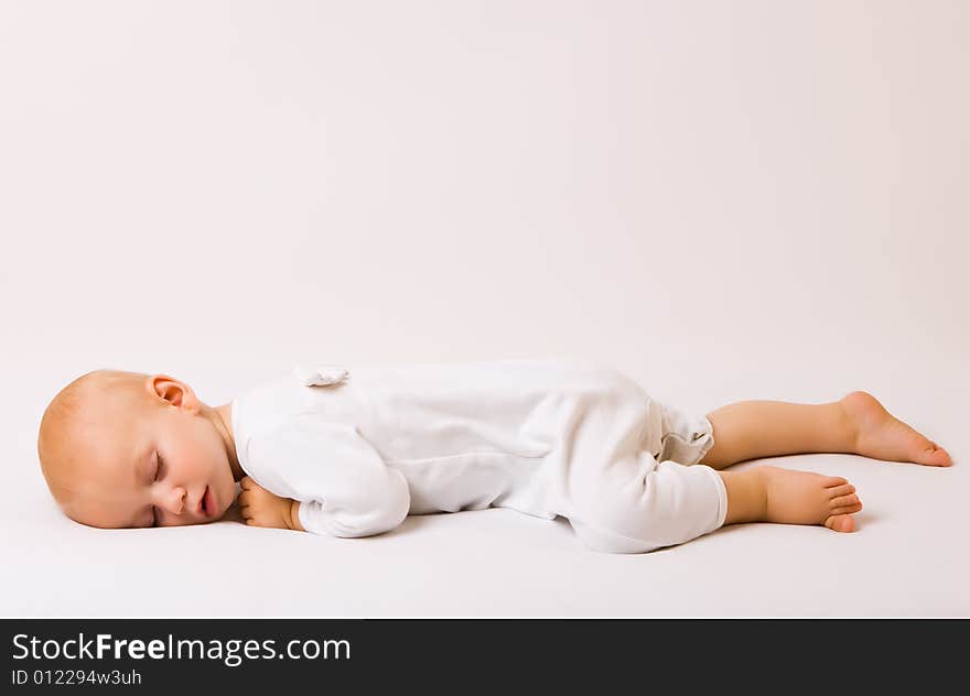 One year old baby boy asleep with angel wings. One year old baby boy asleep with angel wings