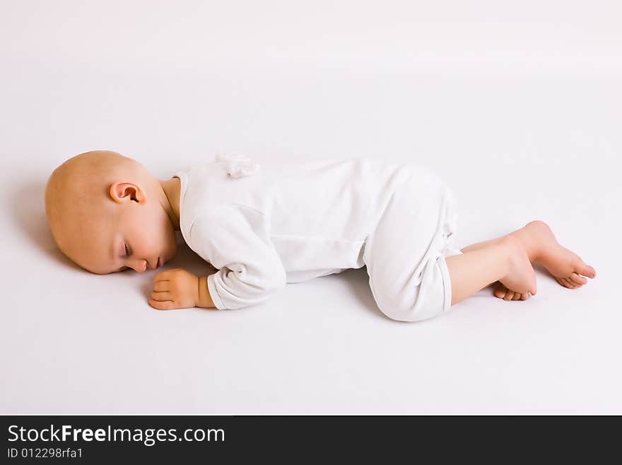 One year old baby boy asleep with angel wings. One year old baby boy asleep with angel wings