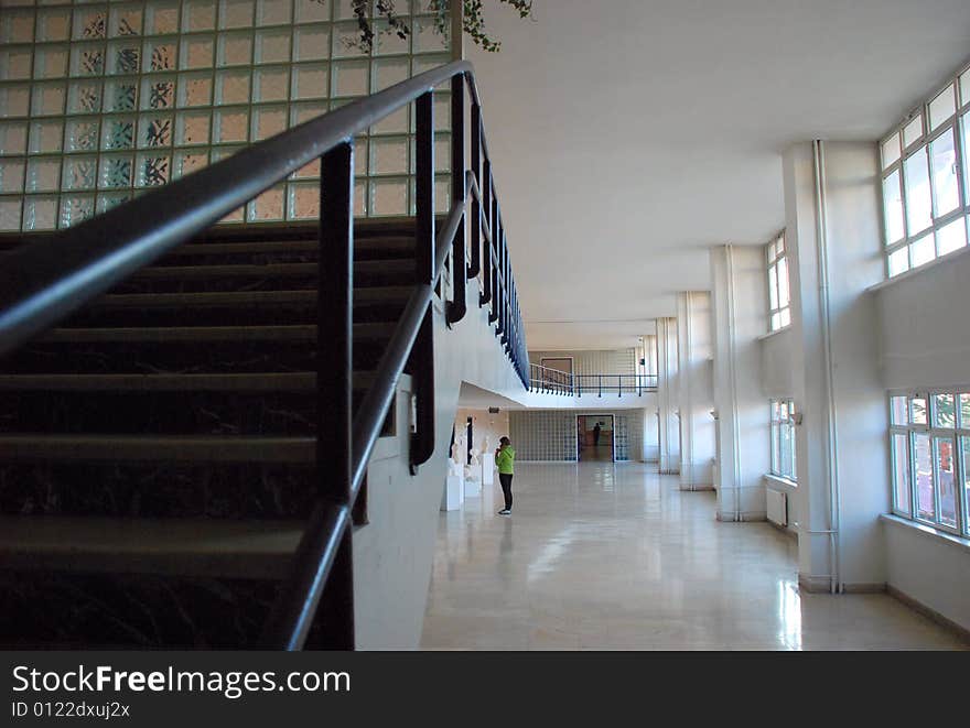 Interior of museum and a visitor woman. Interior of museum and a visitor woman