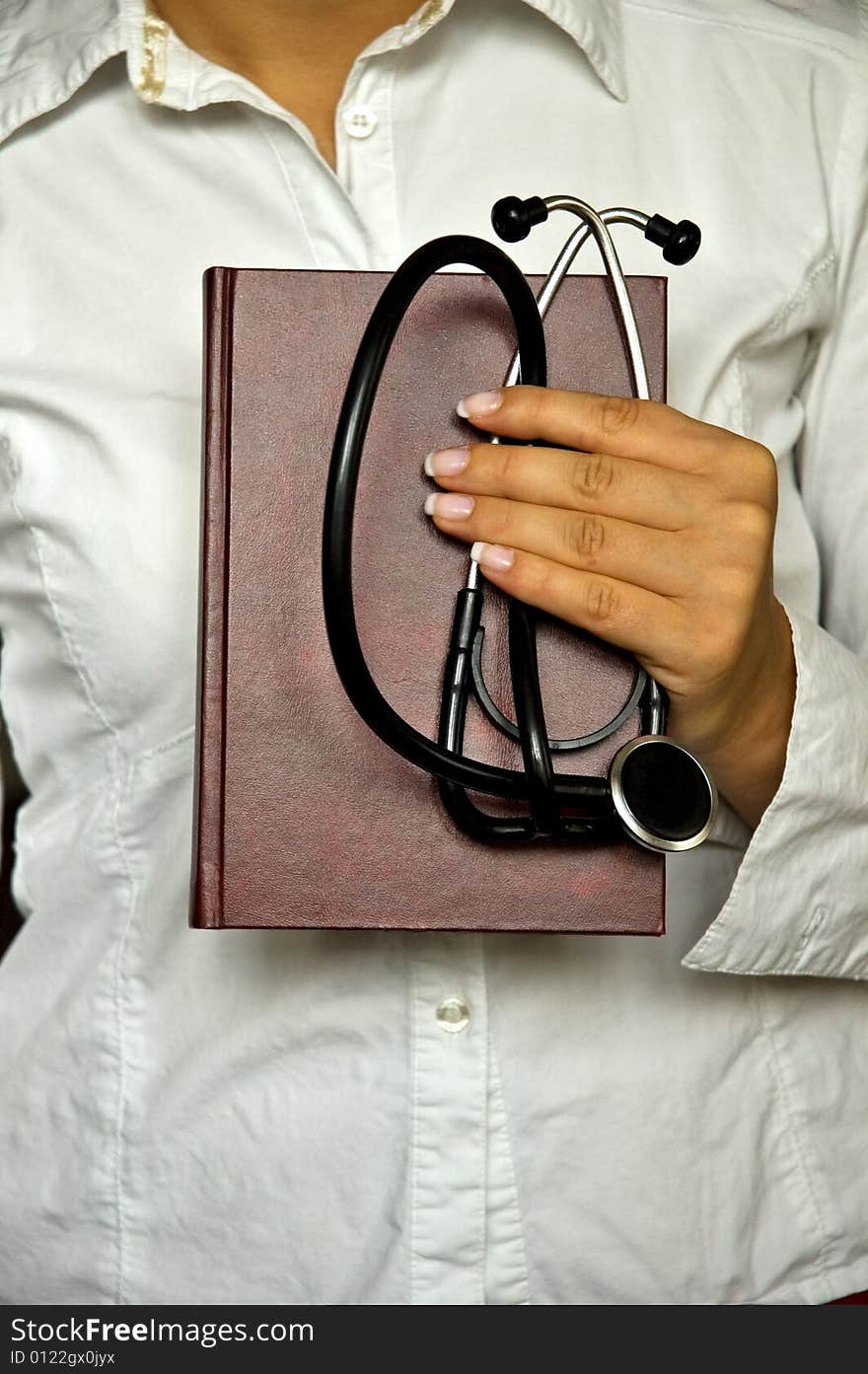 Young female doctor have stethoscope and notebook