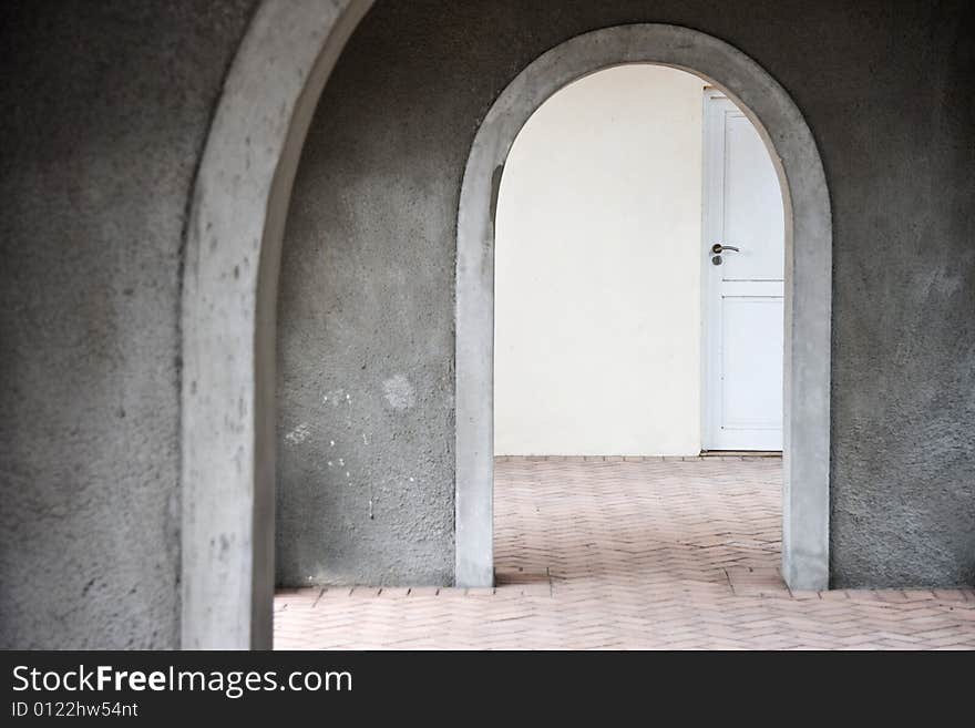 Mysterious door seen through arches