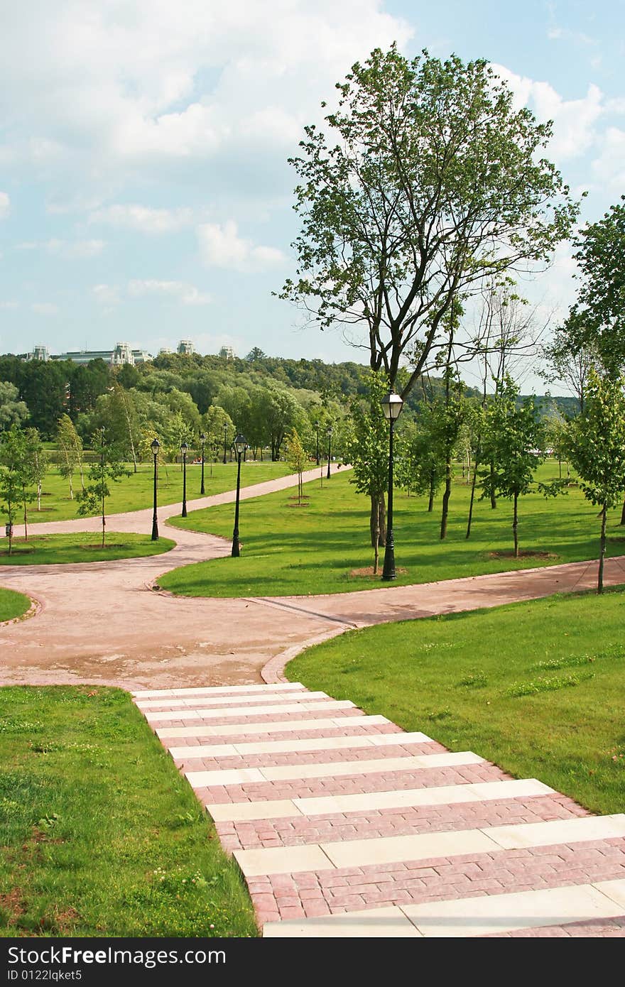 Beautiful well-groomed park with paths and a lawn