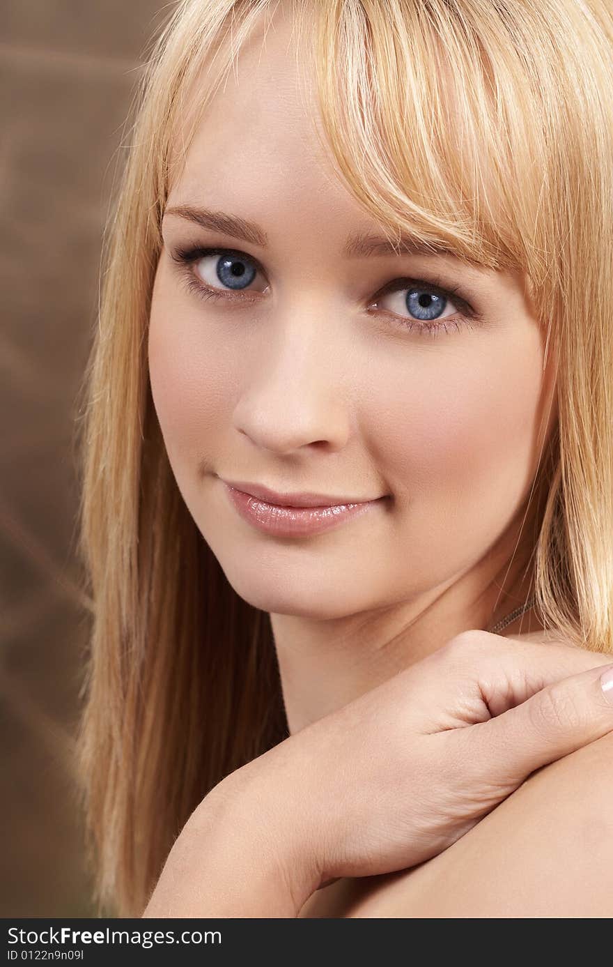 Portrait of a beautiful blonde woman with light blue eyes and natural make-up. Portrait of a beautiful blonde woman with light blue eyes and natural make-up