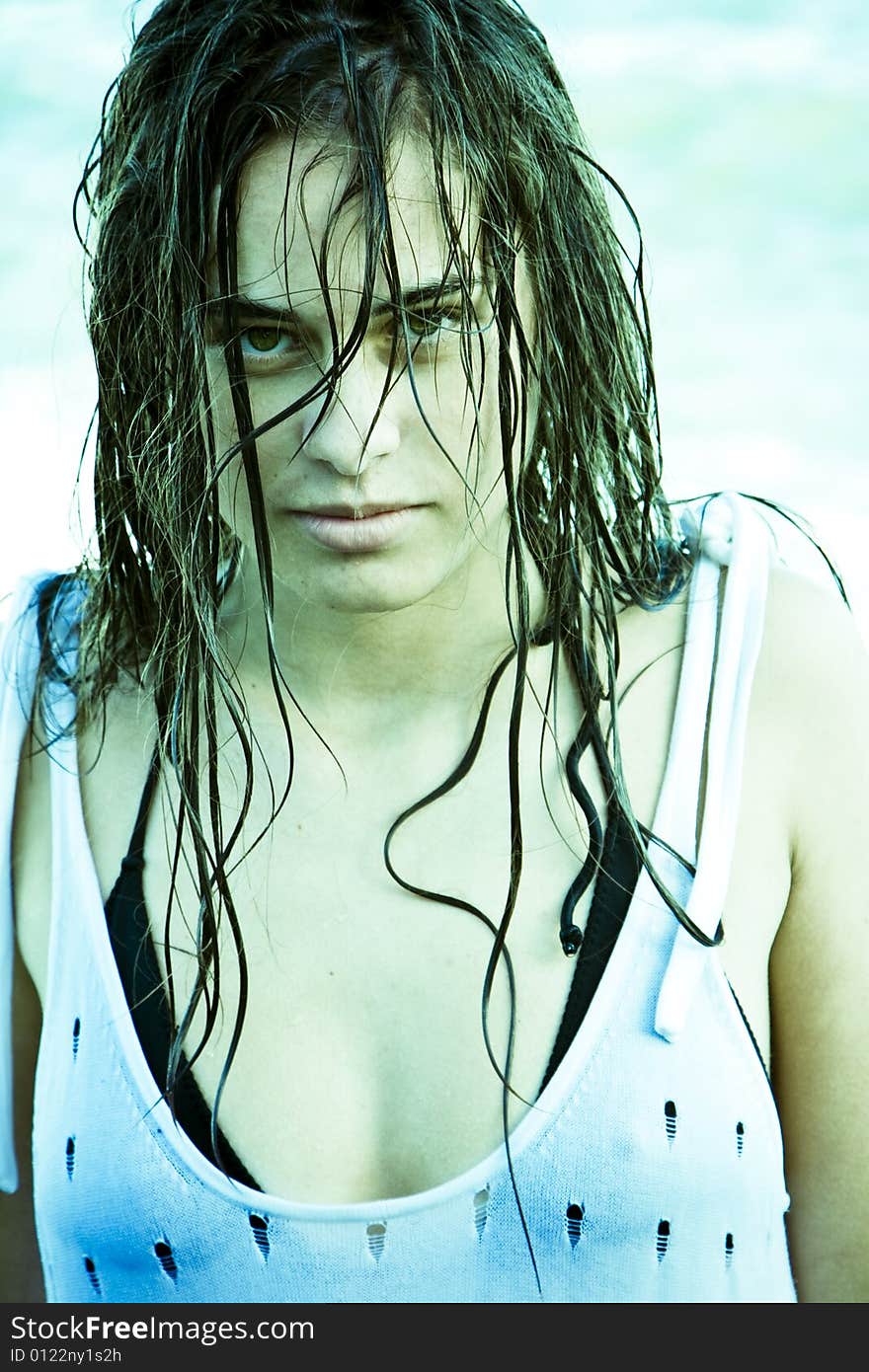 Wet hair woman staring sensually at camera.