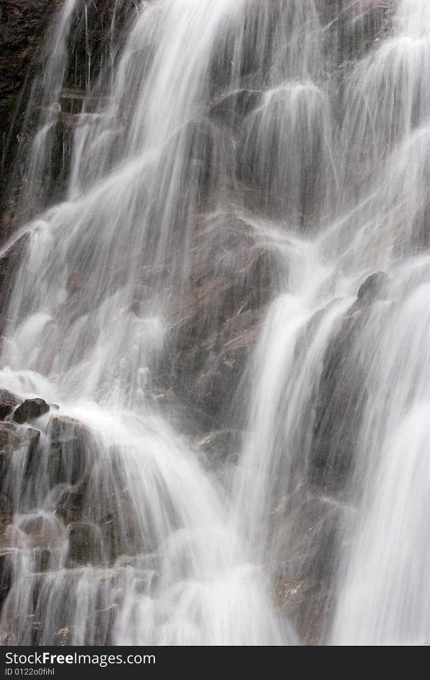 Water flowing down to the mountain rocks. Water flowing down to the mountain rocks