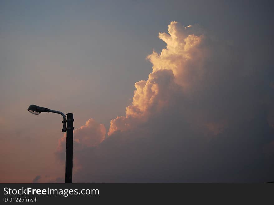 Street lamp and clouds before sunset. Street lamp and clouds before sunset