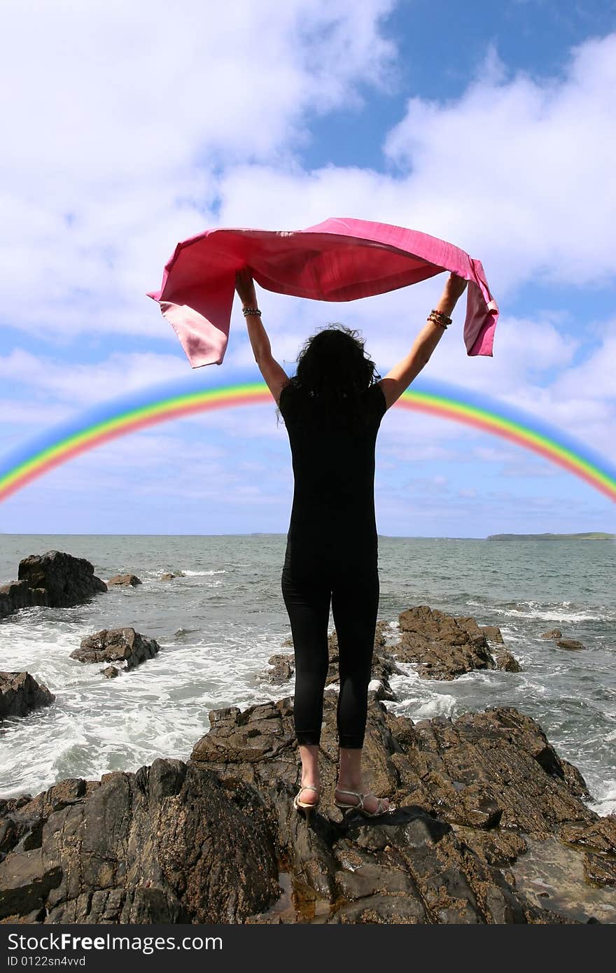 A beautiful woman chasing a rainbow to show a healthy way to live a happy and relaxed lifestyle in a world full of stress and that you should chase after your dreams. A beautiful woman chasing a rainbow to show a healthy way to live a happy and relaxed lifestyle in a world full of stress and that you should chase after your dreams