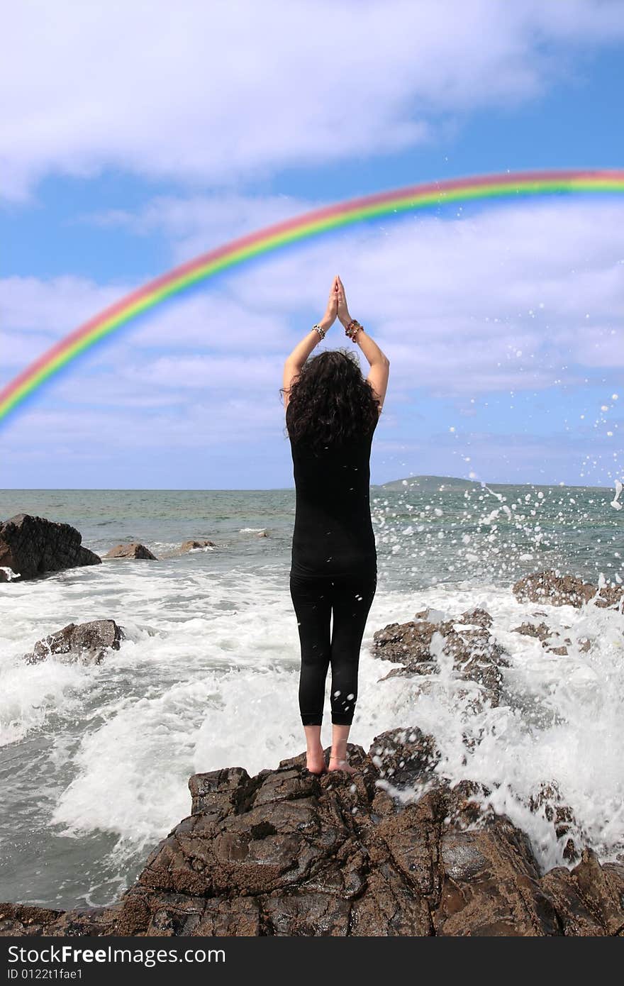 A beautiful woman chasing a rainbow to show a healthy way to live a happy and relaxed lifestyle in a world full of stress and that you should chase after your dreams. A beautiful woman chasing a rainbow to show a healthy way to live a happy and relaxed lifestyle in a world full of stress and that you should chase after your dreams