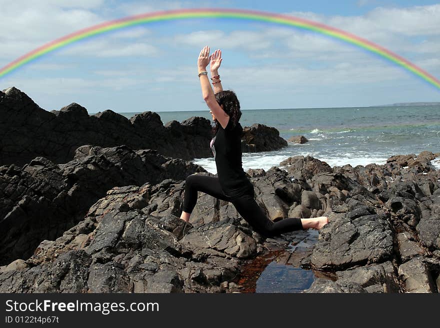 A beautiful woman chasing a rainbow to show a healthy way to live a happy and relaxed lifestyle in a world full of stress and that you should chase after your dreams. A beautiful woman chasing a rainbow to show a healthy way to live a happy and relaxed lifestyle in a world full of stress and that you should chase after your dreams